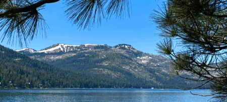 Donner Lake with snow capped mountains