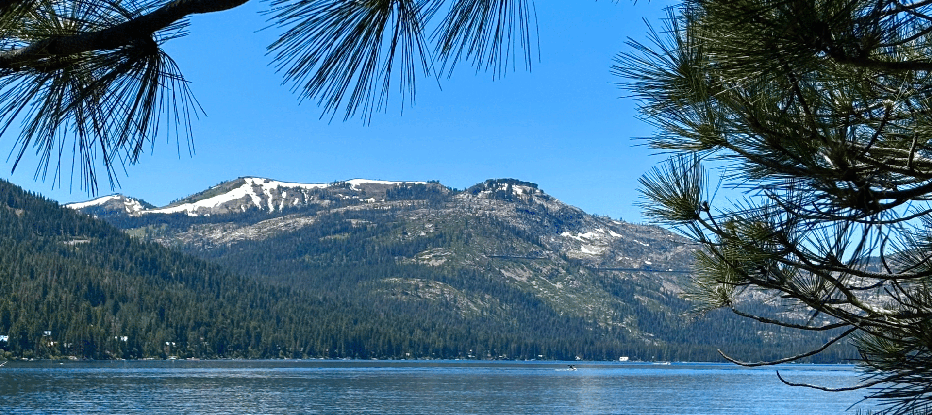 Donner Lake with snow capped mountains